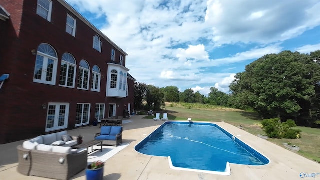 view of pool featuring a patio area, an outdoor hangout area, and french doors