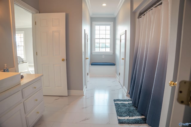 bathroom with vanity, crown molding, and tile patterned flooring