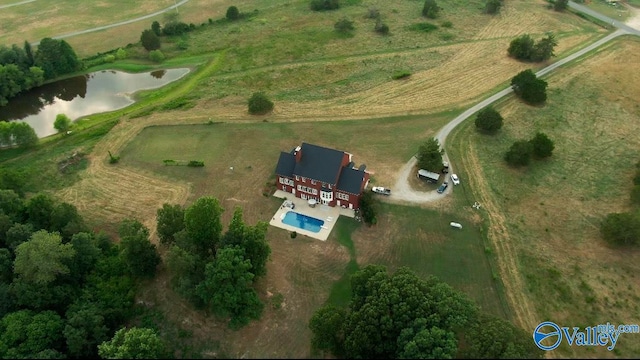 bird's eye view with a water view and a rural view