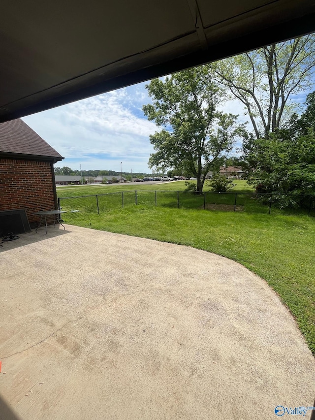 view of patio / terrace featuring fence