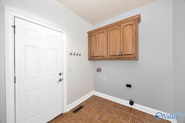 105 Patdean Dr, Huntsville, AL 35811 - washroom with baseboards, cabinet space, washer hookup, dark tile patterned floors, and hookup for an electric dryer