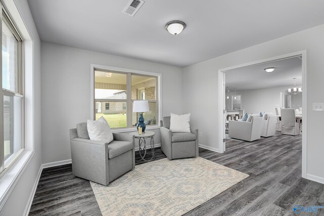117 Huffman St, Hazel Green, AL 35750 - living area featuring dark wood-style flooring, visible vents, and baseboards