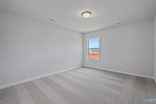 117 Huffman St, Hazel Green, AL 35750 - spare room featuring carpet, visible vents, and baseboards