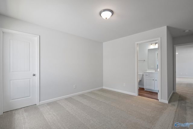 117 Huffman St, Hazel Green, AL 35750 - unfurnished bedroom featuring carpet flooring, a sink, ensuite bath, and baseboards