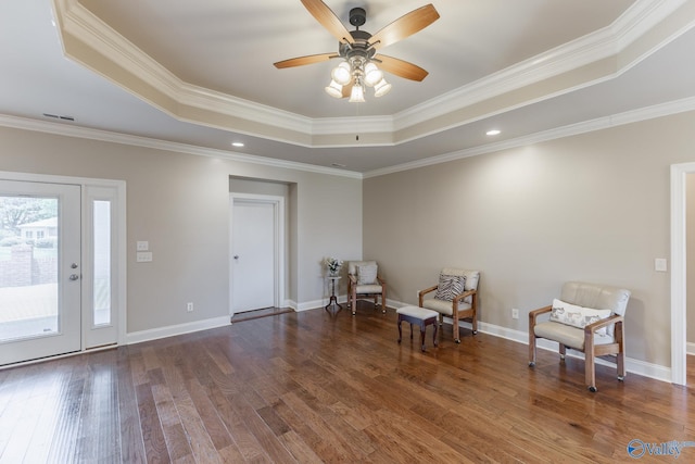 101 Tempo Cir, Harvest, AL 35749 - sitting room featuring a raised ceiling, wood finished floors, a ceiling fan, ornamental molding, and baseboards