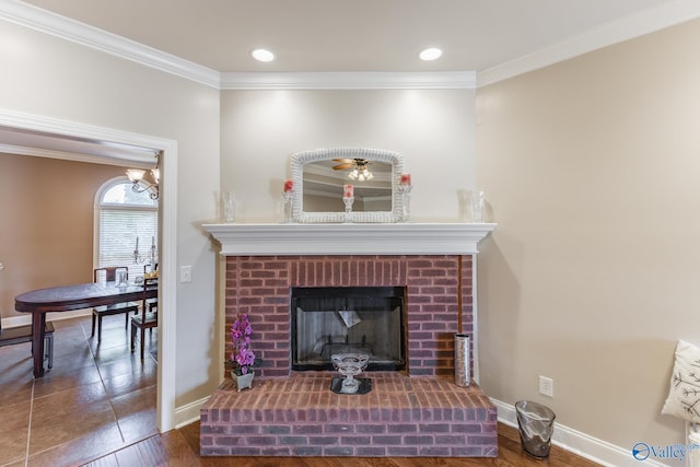 101 Tempo Cir, Harvest, AL 35749 - detailed view of crown molding, baseboards, a fireplace, wood finished floors, and recessed lighting