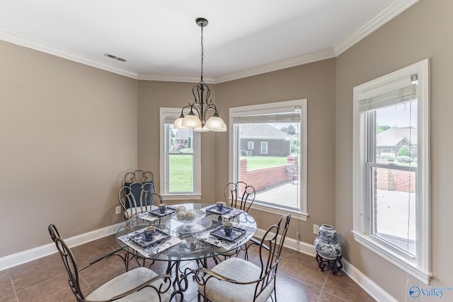 101 Tempo Cir, Harvest, AL 35749 - tiled dining room featuring plenty of natural light, crown molding, baseboards, and a chandelier