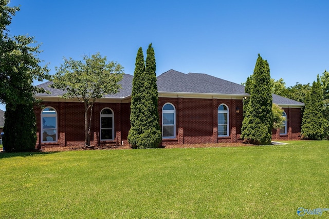 101 Tempo Cir, Harvest, AL 35749 - view of front facade featuring a front lawn, brick siding, and a shingled roof