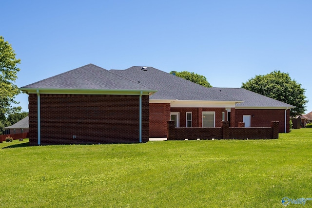 101 Tempo Cir, Harvest, AL 35749 - back of house with a lawn, a shingled roof, and brick siding