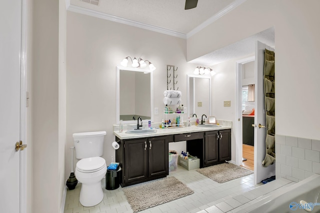full bath featuring ornamental molding, toilet, tile patterned flooring, and a sink