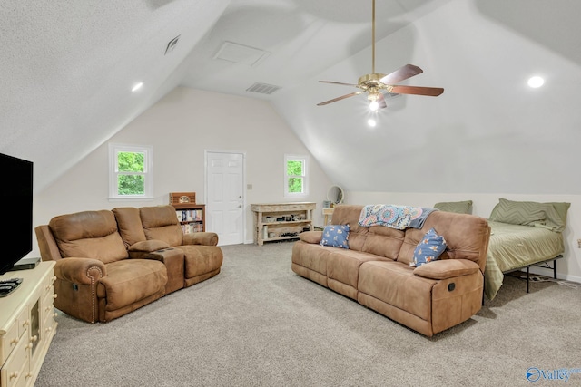 carpeted living room featuring a ceiling fan, visible vents, lofted ceiling, and baseboards