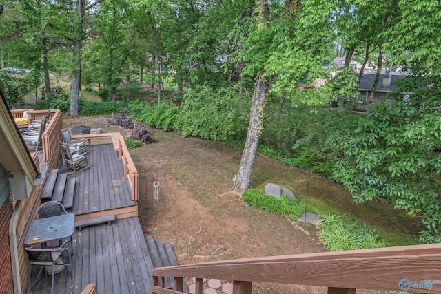 view of yard with a wooden deck
