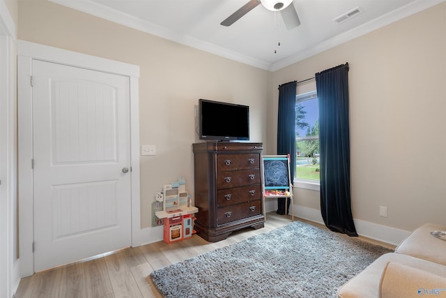 413 Lando Cain Rd, Hartselle, AL 35640 - bedroom featuring crown molding, wood finished floors, a ceiling fan, and baseboards