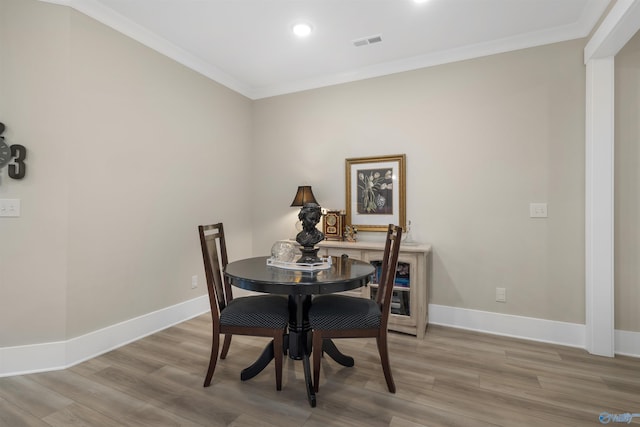 413 Lando Cain Rd, Hartselle, AL 35640 - dining space with ornamental molding, light wood-style floors, baseboards, and recessed lighting