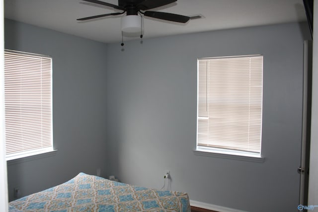 unfurnished bedroom featuring ceiling fan