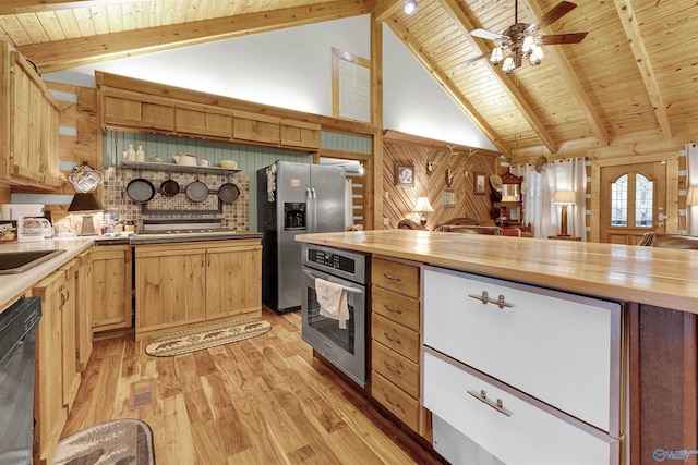 kitchen featuring stainless steel appliances, light hardwood / wood-style flooring, beamed ceiling, butcher block countertops, and ceiling fan