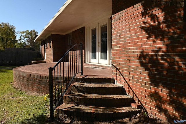 entrance to property with french doors and brick siding