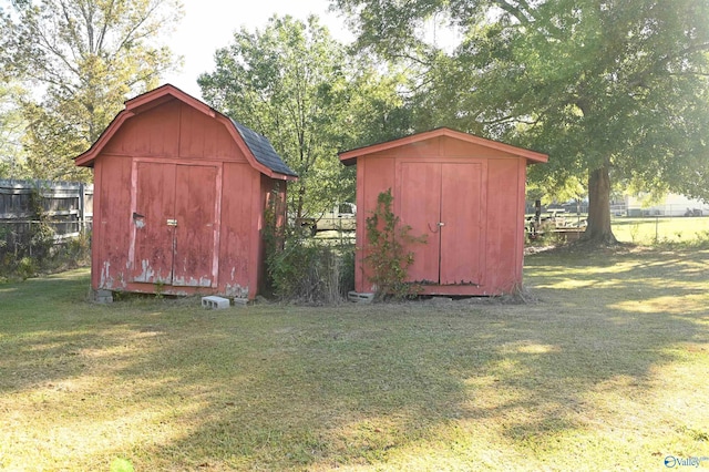 view of shed with fence