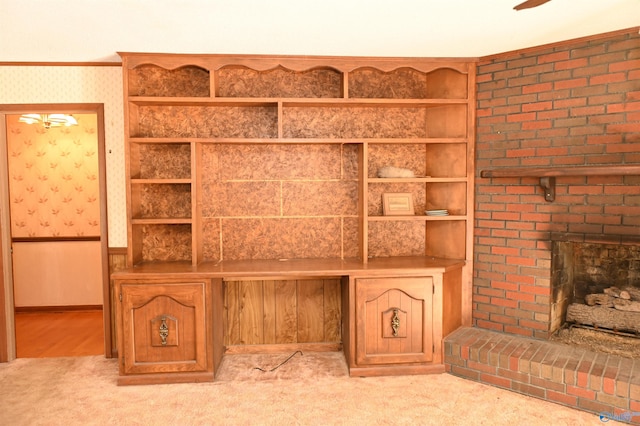 details featuring a brick fireplace, carpet, and wallpapered walls