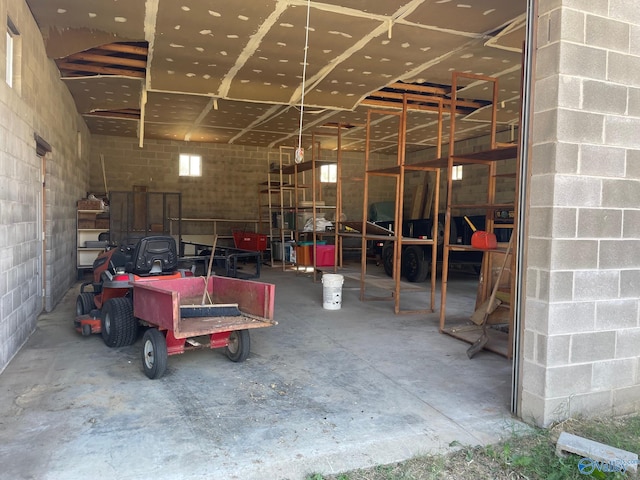 garage with concrete block wall