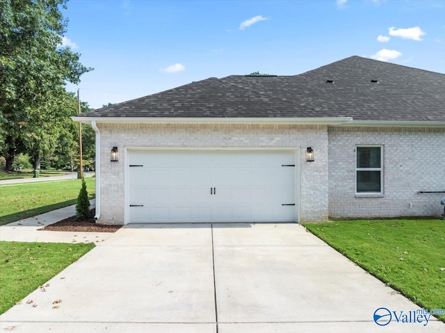 exterior space with a garage and a yard