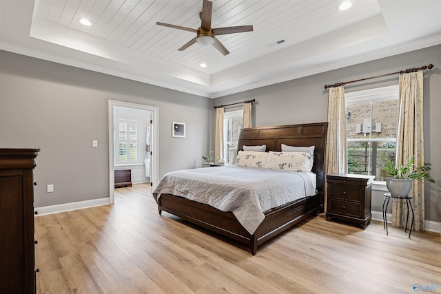 bedroom featuring multiple windows, light hardwood / wood-style flooring, wooden ceiling, and a raised ceiling