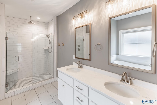 bathroom with vanity, tile patterned flooring, and a shower with door