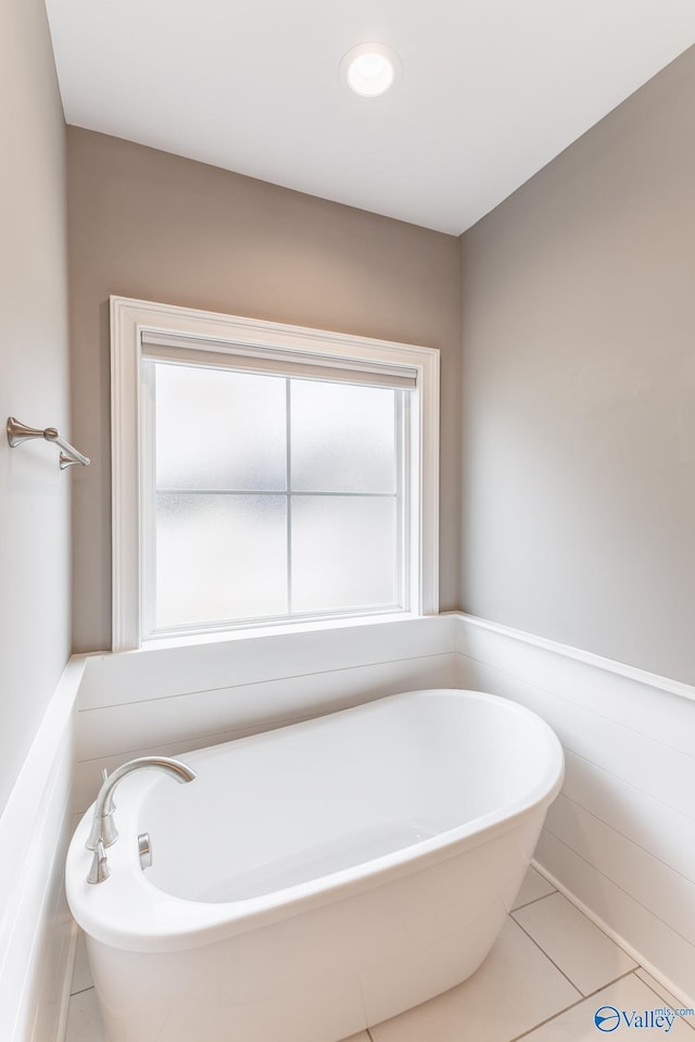 bathroom featuring a tub and tile patterned floors