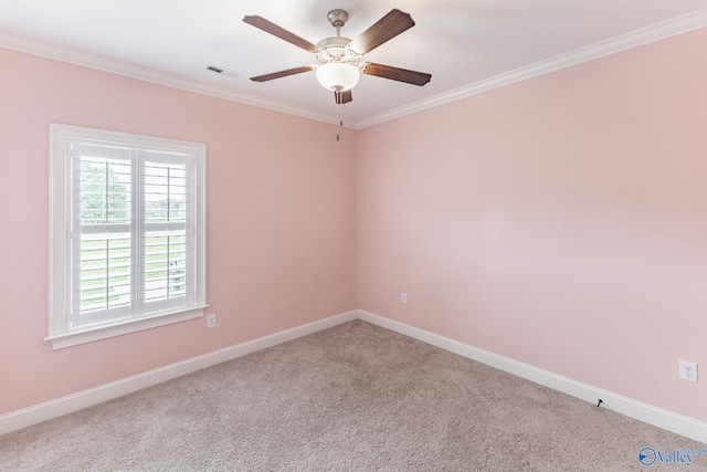 empty room featuring ornamental molding, light carpet, and ceiling fan