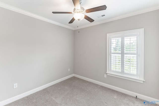 unfurnished room with carpet floors, ornamental molding, and ceiling fan