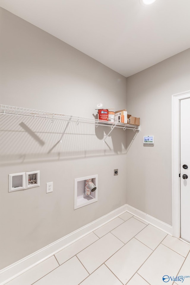 clothes washing area featuring hookup for a washing machine, tile patterned floors, and hookup for an electric dryer