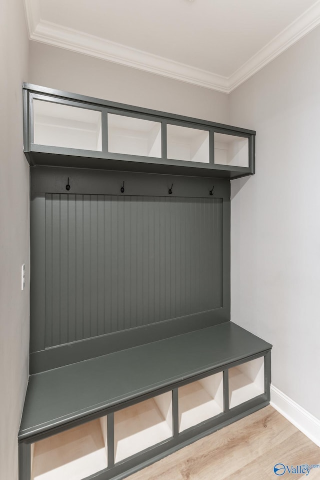 mudroom featuring hardwood / wood-style flooring and crown molding