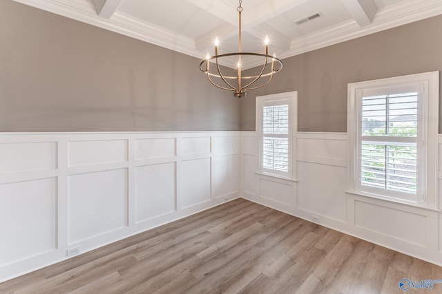 unfurnished dining area featuring a healthy amount of sunlight, beam ceiling, light hardwood / wood-style floors, and a notable chandelier