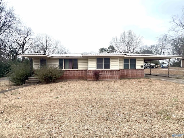 single story home with a carport