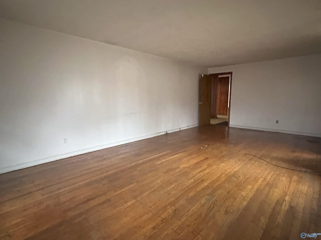 empty room featuring wood-type flooring