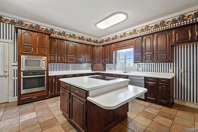 kitchen with light tile patterned flooring, crown molding, and appliances with stainless steel finishes