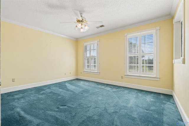 empty room featuring dark carpet, a textured ceiling, crown molding, and ceiling fan