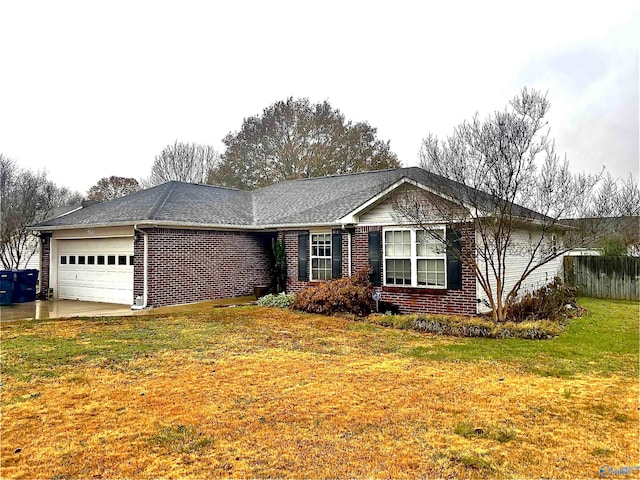 single story home with a front yard and a garage