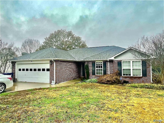 ranch-style home featuring a front yard and a garage