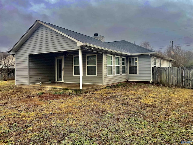 rear view of house with a patio