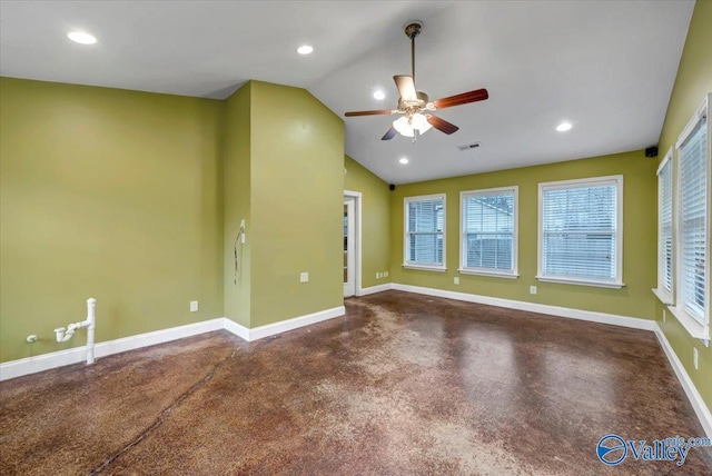 empty room featuring ceiling fan and vaulted ceiling