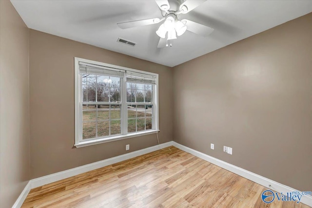 spare room with ceiling fan and light hardwood / wood-style flooring