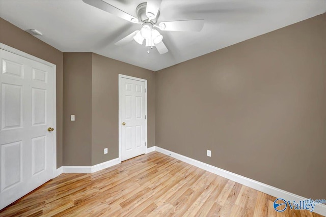 unfurnished bedroom featuring light hardwood / wood-style floors and ceiling fan