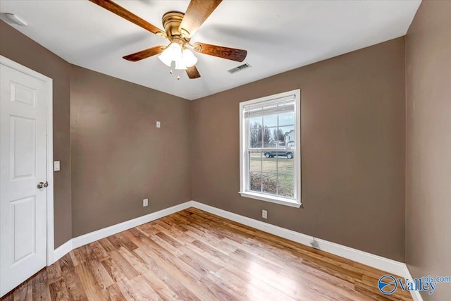 unfurnished room with ceiling fan and light wood-type flooring