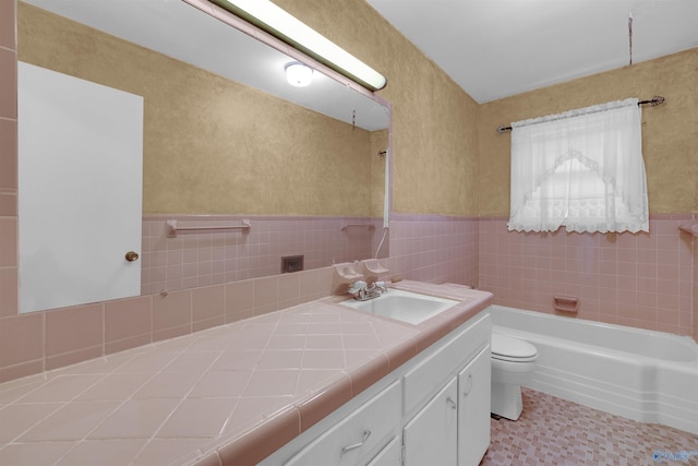 full bathroom with shower / bathing tub combination, vanity, toilet, and tile walls