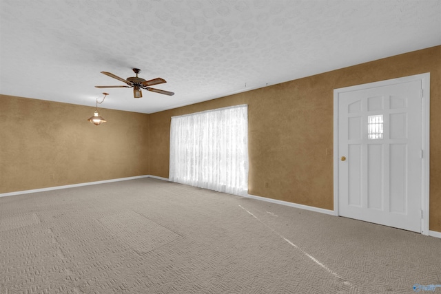 interior space featuring a textured ceiling and ceiling fan