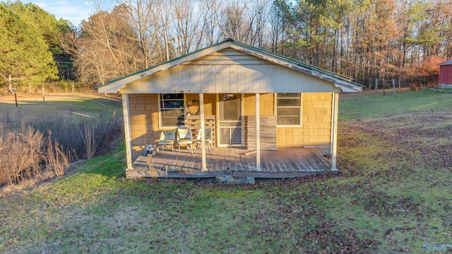 view of outbuilding featuring a yard