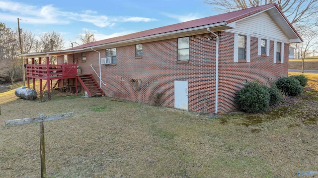 view of home's exterior with a lawn, cooling unit, and a deck