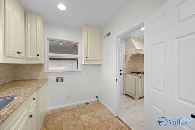 laundry room with cabinets and hookup for a washing machine