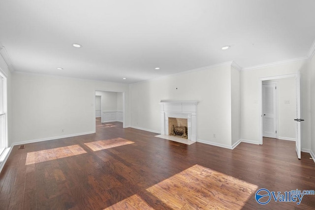 unfurnished living room featuring dark hardwood / wood-style flooring and ornamental molding